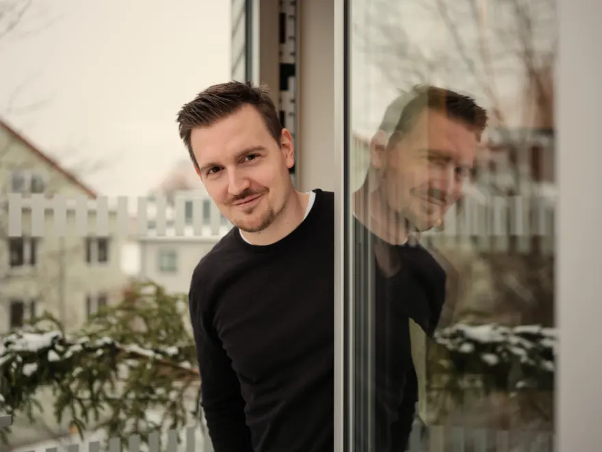 Michael Zorez leaning out of a doorway